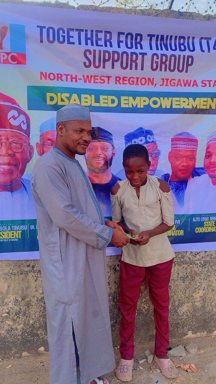 T4T State Coordinator presenting an empowerment package to a beneficiary in Jigawa State