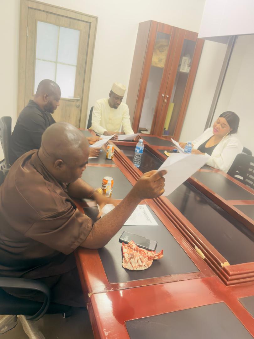 T4T leadership team reviewing documents at the National Secretariat